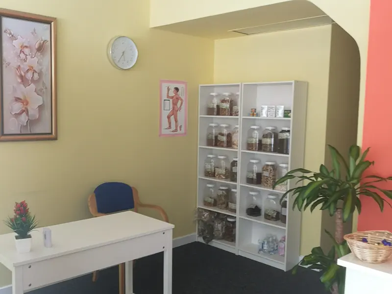 The reception corner, with shelves of traditional herb jars
